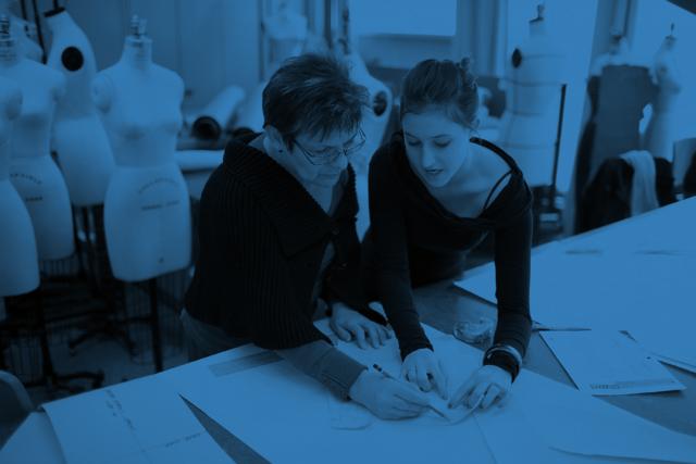 Fashion student works on a pattern with an instructor